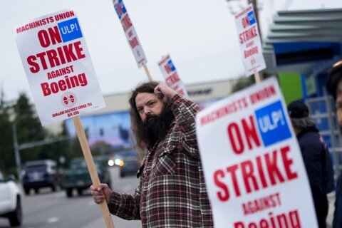 Boeing says it’s considering temporary layoffs to save cash during the strike by machinists