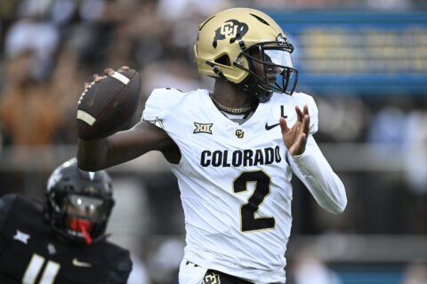 Shedeur Sanders throws for 290 yards, 3 TDs to lead improved Colorado to 48-21 rout of UCF