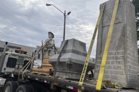 A Mississippi town moves a Confederate monument that became a shrouded eyesore