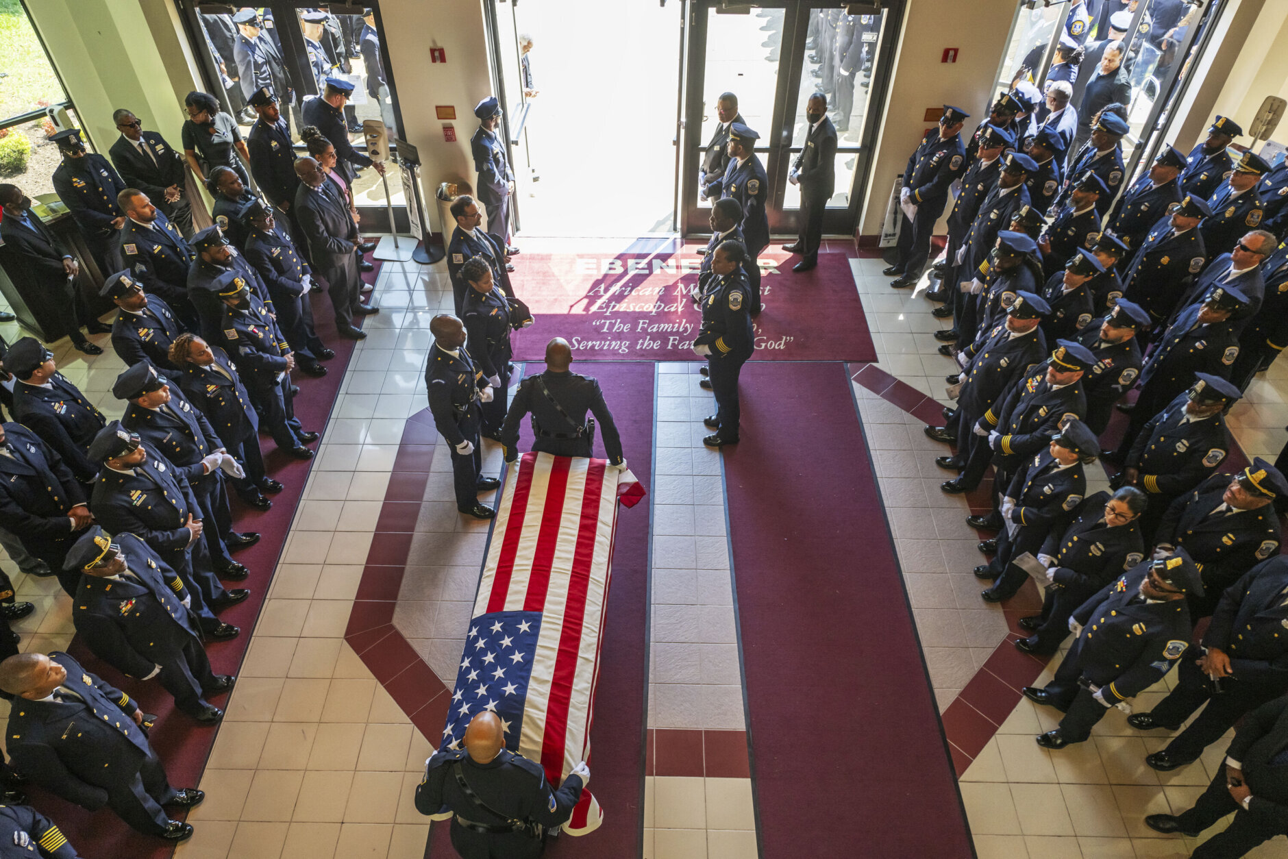 The casket of D.C. police officer Wayne David is rolled out following a funeral service at Ebenezer AME Church, Thursday, Sept. 12, 2024, in Fort Washington, Md.