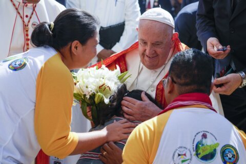 Pope lands in economic power Singapore after a joyous visit to impoverished, devout East Timor