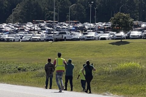 Shooter kills 4 at a Georgia high school and a suspect is in custody, officials say