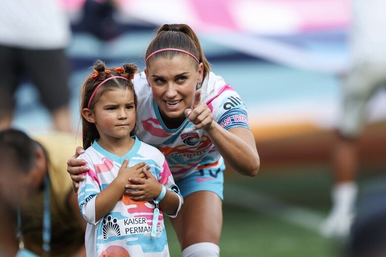 SAN DIEGO, CALIFORNIA - SEPTEMBER 08: Alex Morgan #13 of San Diego Wave FC interacts with her daughter, Charlie, before the game against North Carolina Courage at Snapdragon Stadium on September 08, 2024 in San Diego, California. (Photo by Meg Oliphant/Getty Images)