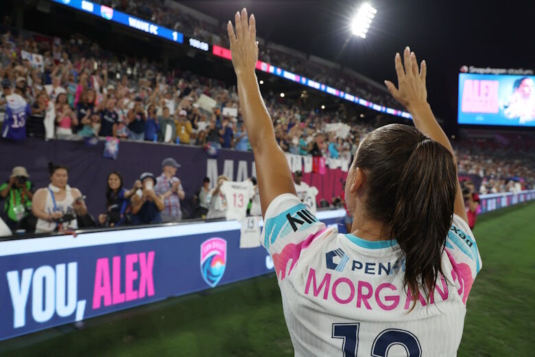 SAN DIEGO, CALIFORNIA - SEPTEMBER 08: Alex Morgan #13 of San Diego Wave FC waves to the crowd after the game against the North Carolina Courage at Snapdragon Stadium on September 08, 2024 in San Diego, California. This was Morgan’s final NWSL game before her announced retirement. (Photo by Kaelin Mendez/Getty Images)