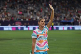 SAN DIEGO, CALIFORNIA - SEPTEMBER 08: Alex Morgan #13 of San Diego Wave FC waves to the crowd after the game against the North Carolina Courage at Snapdragon Stadium on September 08, 2024 in San Diego, California. This was Morgan’s final NWSL game before her announced retirement. (Photo by Kaelin Mendez/Getty Images)