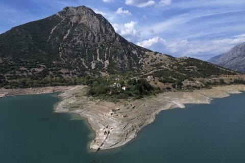 Ruins of a long-sunken Greek village emerge as drought saps a vital reservoir