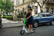 Person riding on Lime scooter
