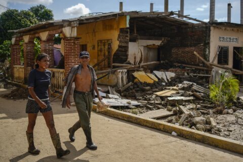 Along Mexico's Pacific coast, flooding from Hurricane John left devastated towns and 17 dead