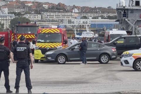 A boat with dozens of migrants rips apart in the English Channel off France, killing 12