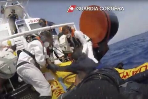 About 20 migrants are reported missing after their boat capsized off Italy