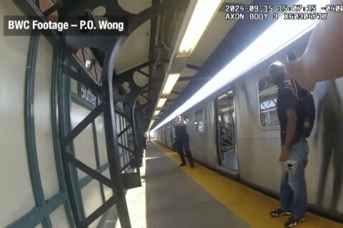 Footage shows NYPD officers firing at man with knife in subway shooting that wounded 4