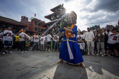 Festival season starts in Nepal with devotees honoring a living goddess