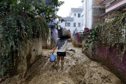 Rescuers search for people still missing in Nepal after flooding and landslides that killed 217