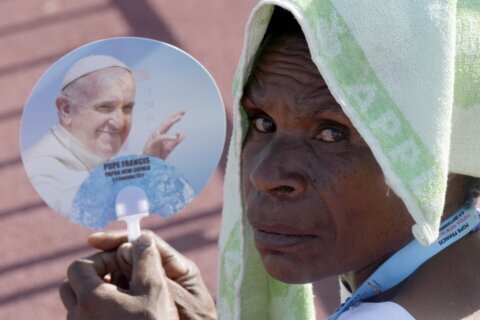 Pope arrives in the remote jungles of Papua New Guinea with a ton of humanitarian aid and toys