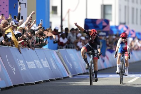 Hunter Woodhall wins Paralympic sprint title to join his wife as a gold medalist