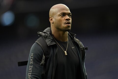 Judge orders former Washington football star Adrian Peterson to turn over assets to pay $12M debt