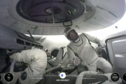 Billionaire steps out of SpaceX capsule for first private spacewalk hundreds of miles above Earth