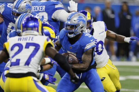 Montgomery's 1-yard touchdown run in OT lifts Lions to 26-20 win over Rams