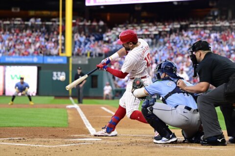 Phils’ Schwarber sets MLB single-season mark with 14th leadoff HR before leaving with hurt elbow