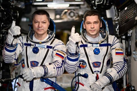 2 Russians set record for longest single stay on the International Space Station