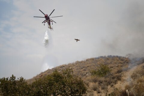 Lightning could worsen wildfire east of LA already threatening 35,000 homes and buildings