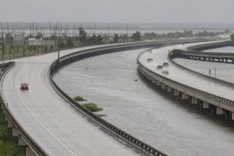 Francine weakens moving inland as the storm leaves behind flooding and widespread power outages