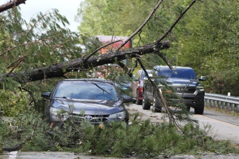 John as a tropical storm hits Mexico's Pacific coast a 2nd time