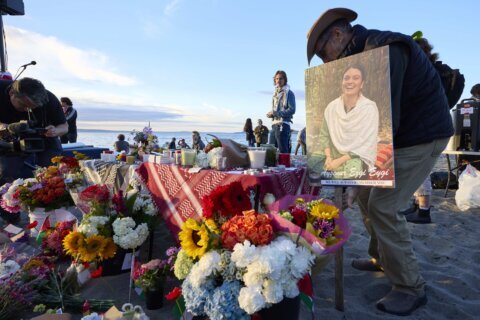 Hundreds gather on a Seattle beach to remember an American activist killed by the Israeli military