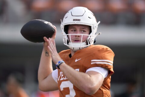 Texas QB Quinn Ewers departs with strained abdomen and Arch Manning takes over for Longhorns