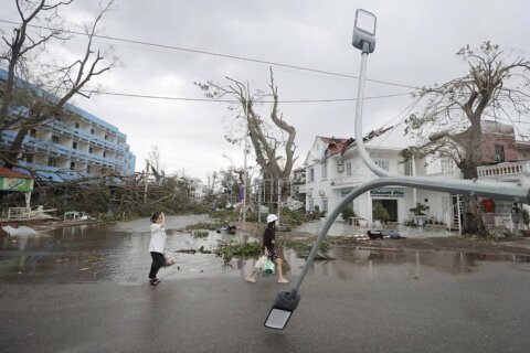 Typhoon Yagi kills 14 in Vietnam as officials warn of heavy rain that can cause flooding