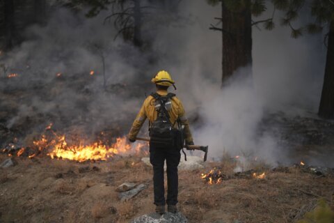 A scenic California mountain town walloped by a blizzard is now threatened by wildfire