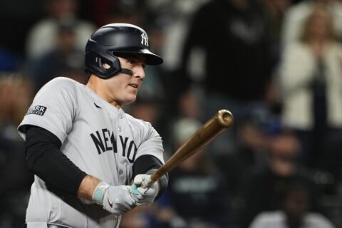 Yankees clinch playoff berth by beating Mariners 2-1 in 10 innings