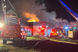 Firefighters fighting fire at closed school building.