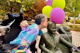 Jeni Stepanek kisses a statue of her son.