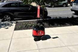 This small robot trundles down D.C. sidewalks snapping pictures. It's part of a pilot program thats helping D.C.s Department of Transportation update its inventory of street signs. (WTOP/Scott Gelman)