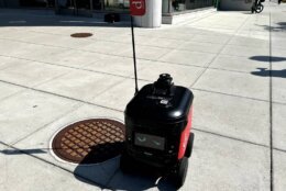 This small robot trundles down D.C. sidewalks snapping pictures. It's part of a pilot program thats helping D.C.s Department of Transportation update its inventory of street signs. (WTOP/Scott Gelman)