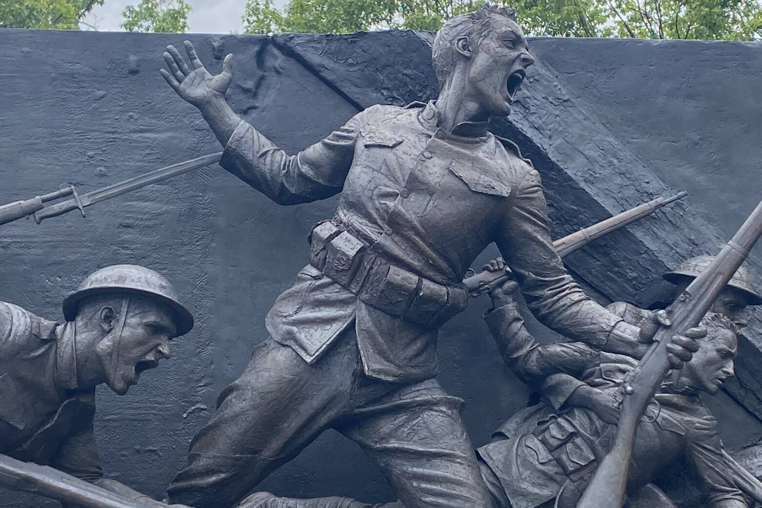 The new World War I Memorial in D.C. is a 3-acre site sitting along Pennsylvania Avenue between the White House and Freedom Plaza. The centerpiece is a 60-foot wall of sculptures, which aim to tell a story from the start of the war to the end. (WTOP/John Domen)