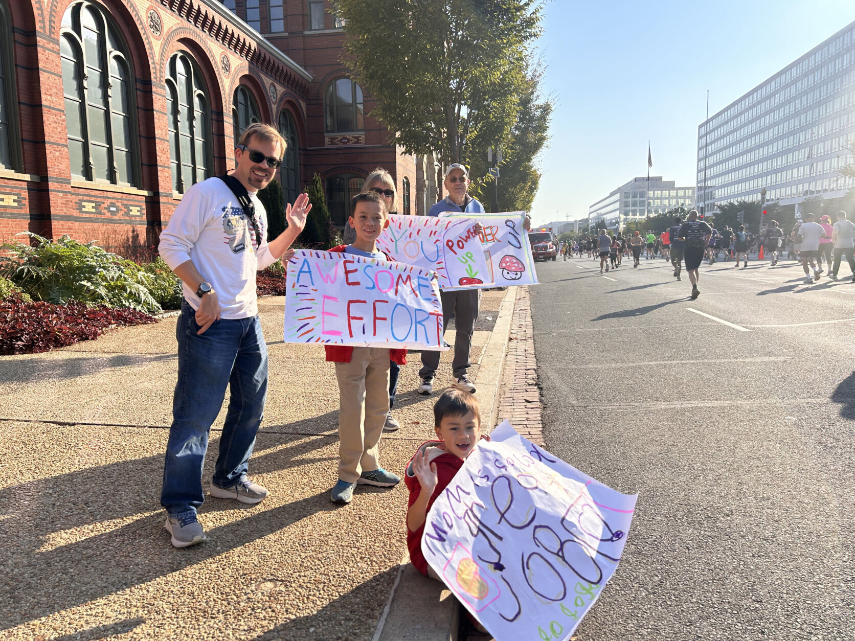 Spectators cheering on Army Ten-Miler runners