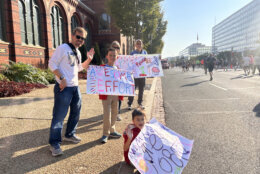 Spectators cheering on Army Ten-Miler runners