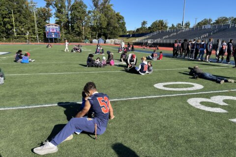 At West Springfield High School, game day also means inspiring first graders to read