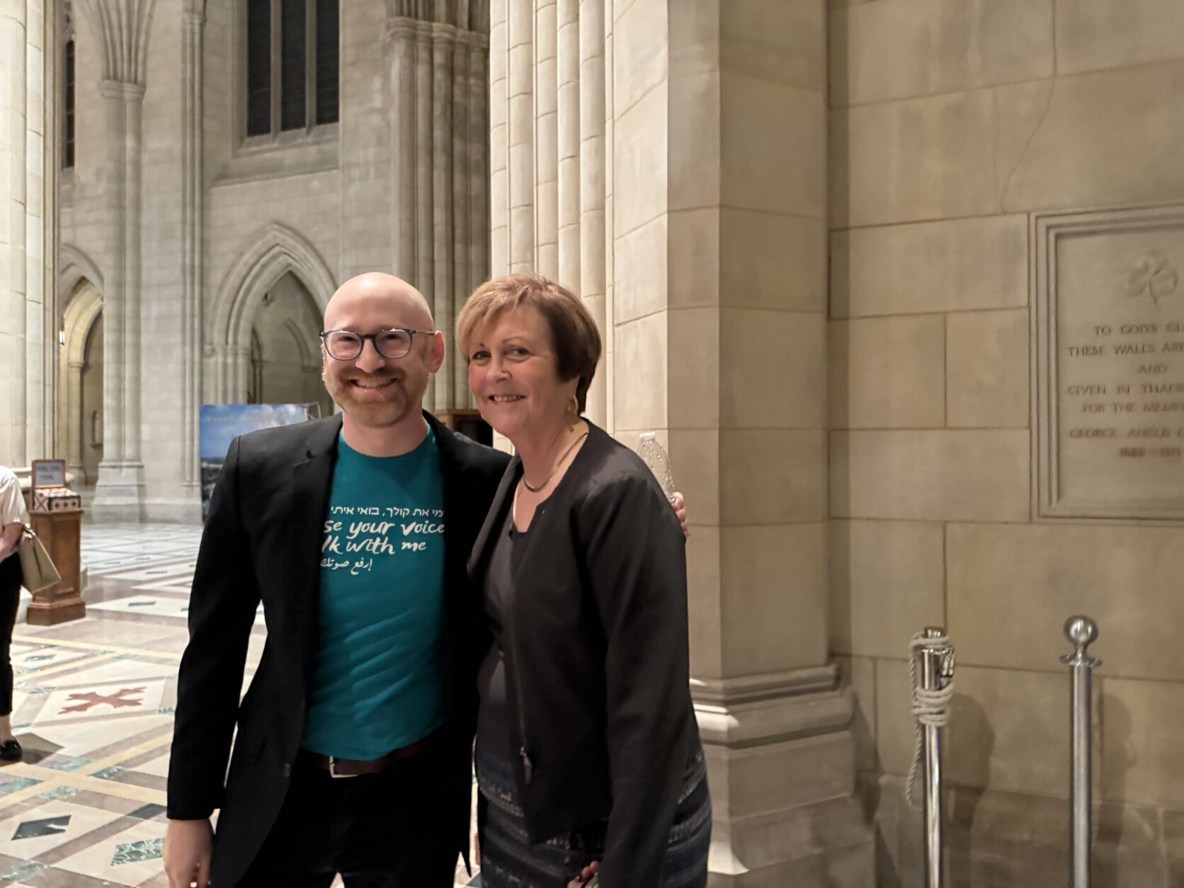 Conductor Micah Hendler (left) and Deborah Rutter, president of the Kennedy Center for the Performing Arts, at The Big Sing on Oct. 23, 2024.