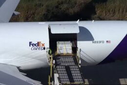 Precious panda cargo -- one of the bears -- is unloaded off the plane at Dulles Airport on Oct. 15, 2024.