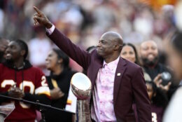 Former Washington defensive back Darrell Green reacts during a jersey retirement ceremony at halftime of an NFL football game between the Washington Commanders and the Carolina Panthers, Sunday, Oct. 20, 2024, in Landover, Md. (AP Photo/Nick Wass)