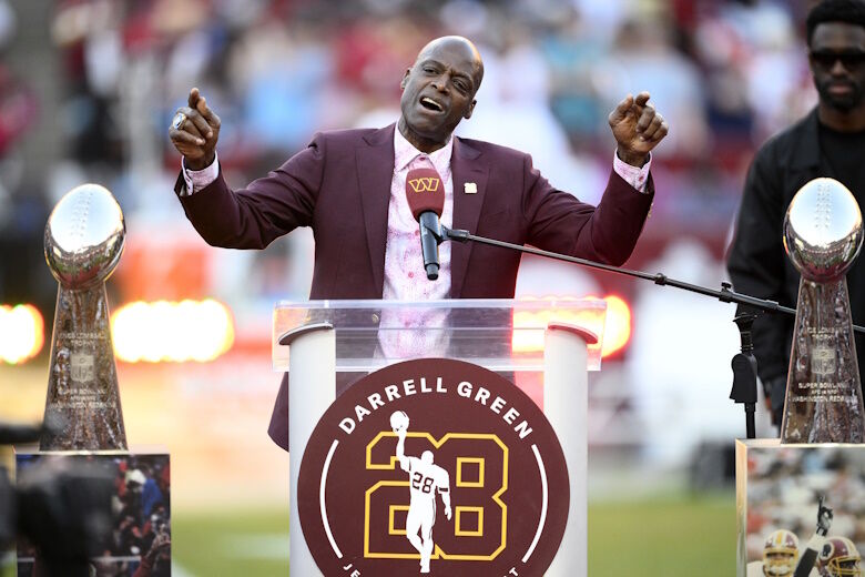 Former Washington defensive back Darrell Green speaks during a jersey retirement ceremony at halftime of an NFL football game between the Washington Commanders and the Carolina Panthers, Sunday, Oct. 20, 2024, in Landover, Md. (AP Photo/Nick Wass)