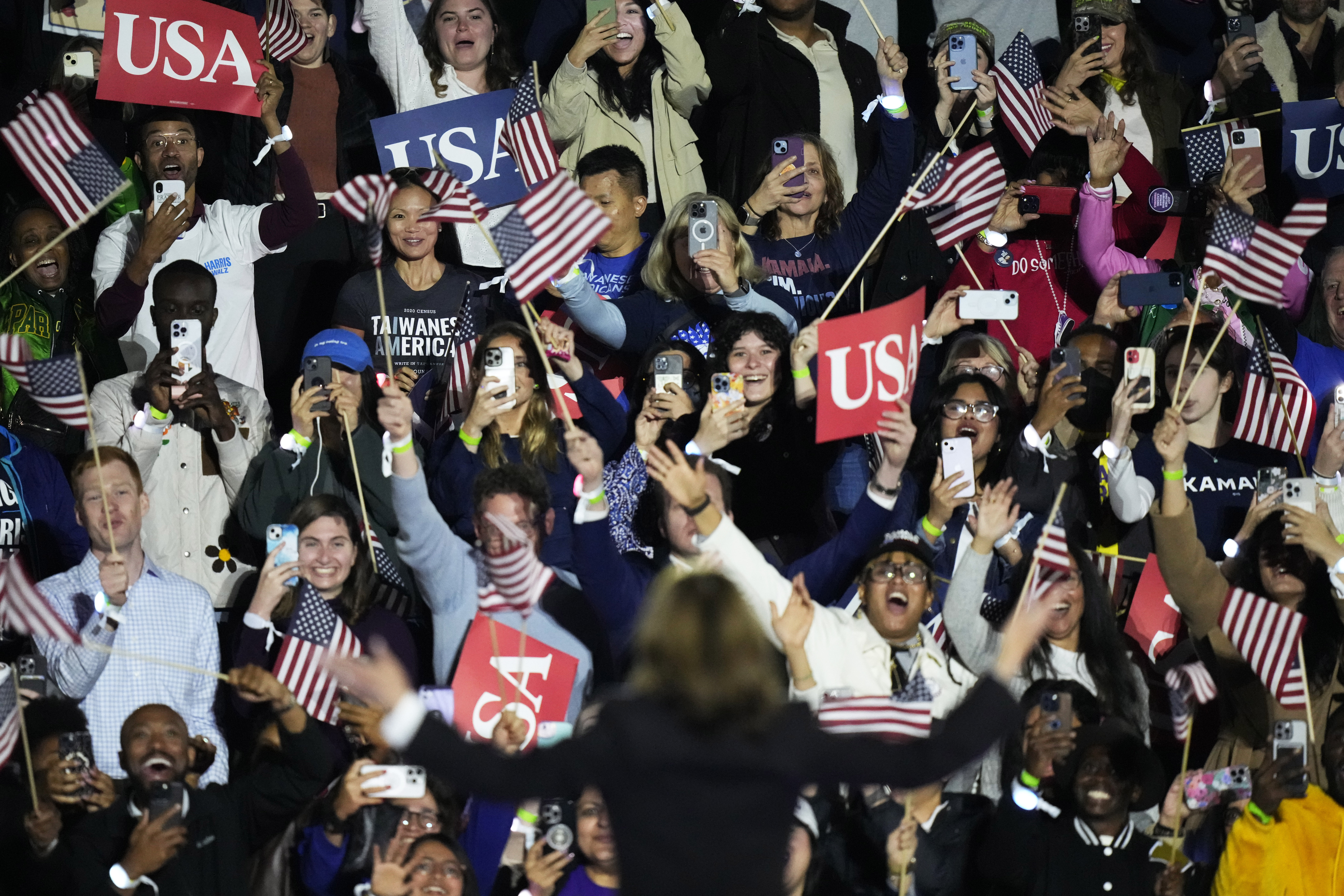 The crowd cheers as Democratic presidential nominee Vice President Kamala Harris arrives to deliver remarks during a campaign event at the Ellipse near the White House in Washington, Tuesday, Oct. 29, 2024. (AP Photo/Stephanie Scarbrough)