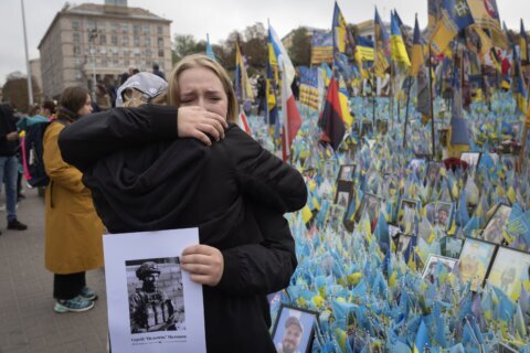 A likely Russian artillery strike kills at least 6 at a Ukrainian market