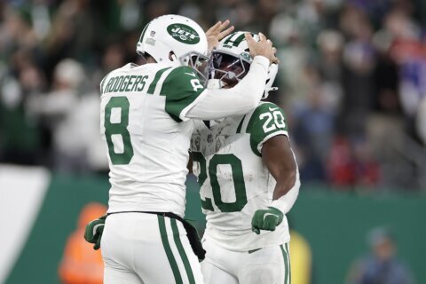 Jets’ Aaron Rodgers throws a 52-yard Hail Mary to Allen Lazard to end the first half vs. Bills