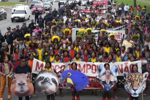 Indigenous people march in Brazil’s capital against bill limiting land rights