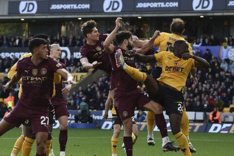 Stones scores injury-time winner as Man City beats struggling Wolves 2-1 in Premier League