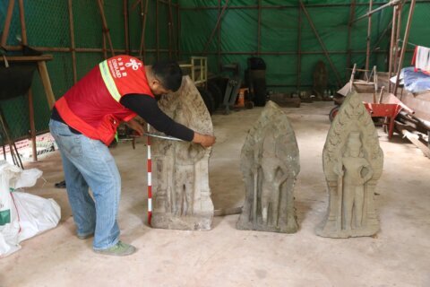 Cambodian archaeologists discover a dozen centuries-old sandstone statues at Angkor UNESCO site